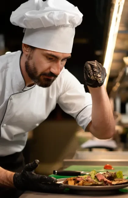 a chef in the kitchen cooking something delicious